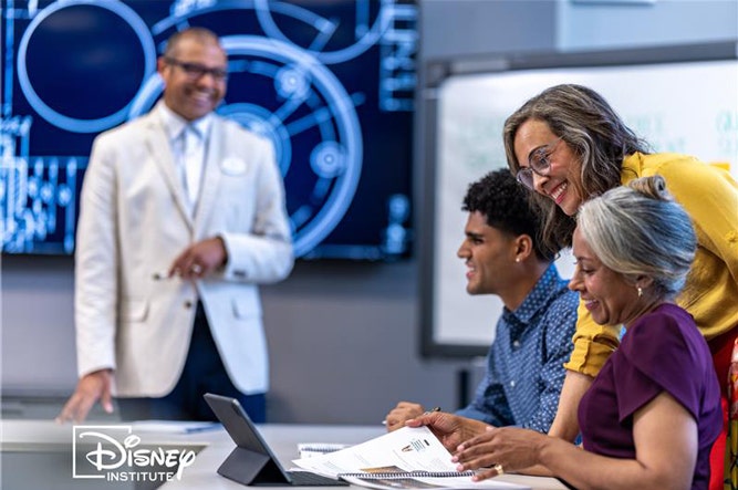 Professionals and students working together during a training session at Disney Institute