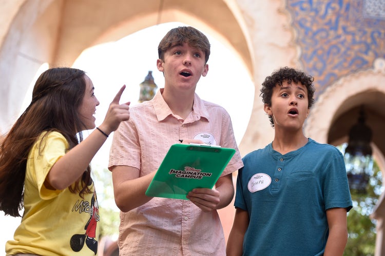 Students in the Epcot Morocco Pavilion with a blue clipboard